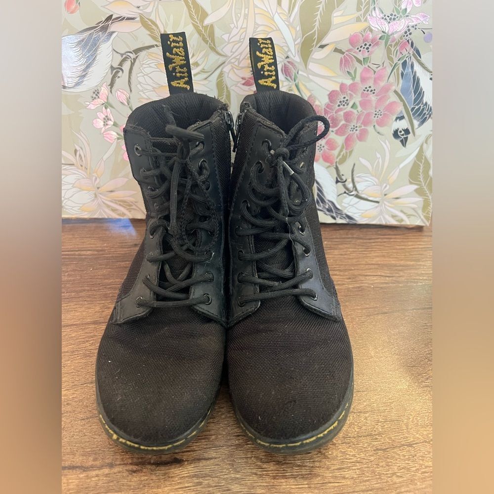 Dr. Martens Black Lace-Up Boots with side zipper.